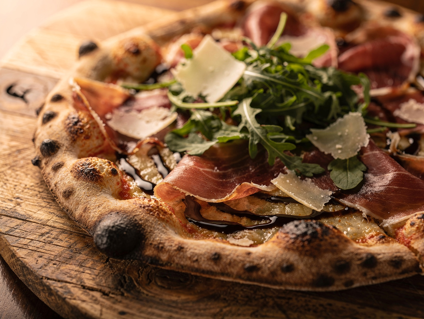 Wood oven pizza topped with fresh burrata and prosciutto di parma